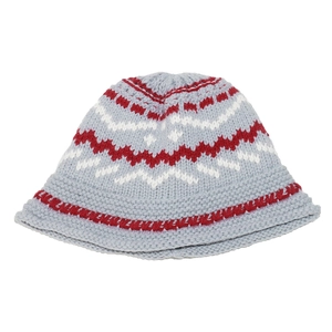 Close-up of Fair Isle knit bucket hat with light blue base and red wave patterns