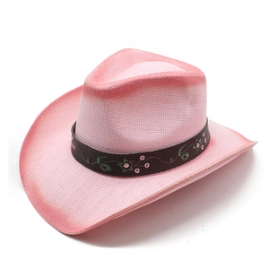 Pink straw cowboy hat detail featuring floral embroidery and metallic studs on band