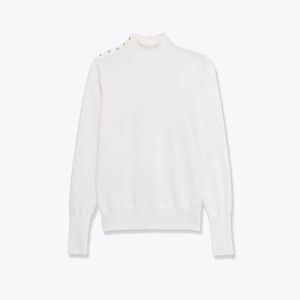 White high neck knit sweater featuring elegant gold shoulder buttons and ribbed cuffs