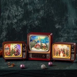 Retro TV Christmas music box with LED lights and snow scene in wood-like finish