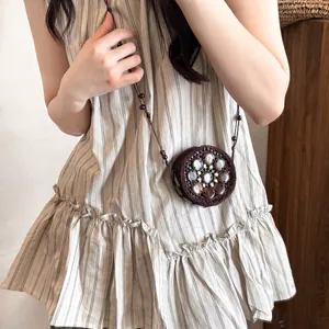 Bohemian style dark brown hand-woven mini round crossbody bag with shell inlay decoration