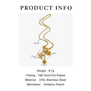 Detail of 18K gold PVD starfish, heart, and pearl charms on a stainless steel necklace