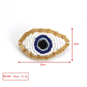 Detail view of Evil Eye brooch with dimensions 52mm x 32mm and weight 10.2g