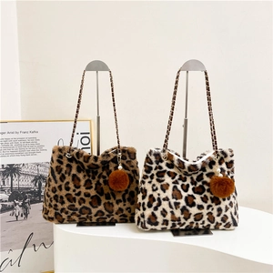 Faux fur leopard print tote bag with metal chain strap and decorative pom pom charm