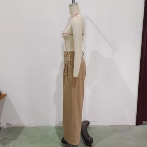 Side view of khaki high-waisted wide-leg trousers showing pocket detail and fabric texture