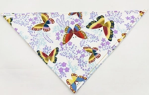 Detail of pet bandana featuring colorful butterfly prints and yellow stitched edges