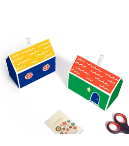 Top view of house-shaped gift boxes in blue and green colors for candy and jewelry