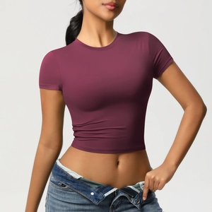 Detail of burgundy slim fit quick-dry yoga t-shirt showing elastic fabric and seams