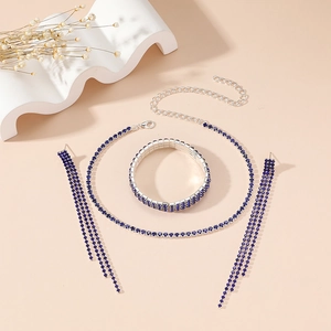 Detail of dark blue rhinestone necklace, multi-layer bracelet and tassel earrings set