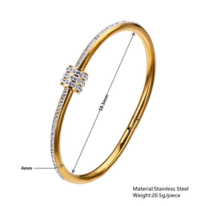 Gold stainless steel bangle with sparkling zircon spinning charms and side stones