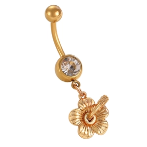Detail of a gold floral belly ring with a clear zircon stone and intricate petal textures
