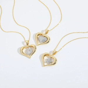 Hollow heart necklace with inlaid cubic zirconia in three different inner pendant styles