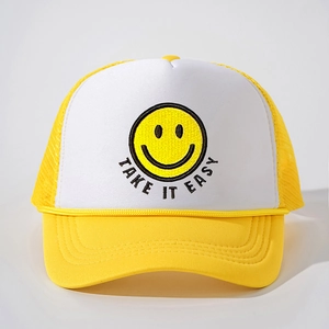 Close-up of yellow smiley face embroidery and Take It Easy text on trucker hat