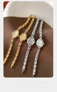 Detailed close-up of floral chain bracelets with crystal accents and oval watch dials