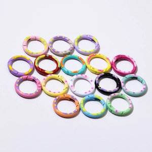 Colorful spring ring buckles for DIY keychains with decorative polka dot texture patterns