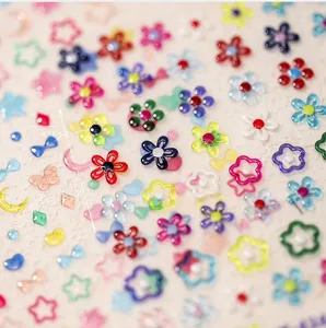 Macro shot of 3D jelly texture nail art stickers with colorful flowers and bows