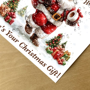 Detail of Christmas Santa toilet sticker with festive 'Ho Ho Ho' text on wood background