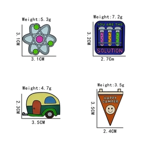 Detail view of four enamel science and camping pins with weight and size specifications
