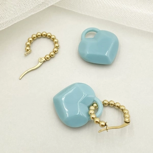 Chic heart-shaped blue acrylic pendant earrings with golden titanium steel hoops