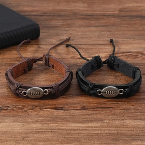 Men's braided leather bracelet featuring an alloy rugby football charm in black and brown