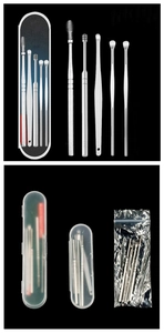 Macro view of stainless steel earwax removal tools with spiral cleaners and storage cases