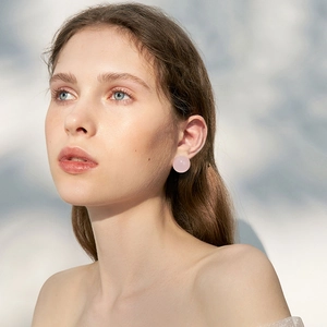 Elegant round pink quartz stud earrings for women with S925 silver needle on model