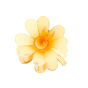 Hollow frangipani flower hair claw clip in translucent orange resin for elegant updos
