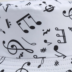 White canvas bucket hat with black music note print featuring high-quality stitching detail