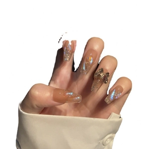 Luxurious aurora butterfly press-on nails in sheer milk tea pink with crystal accents