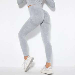 Detail of high-waist seamless yoga leggings with scrunch butt lift and acid wash texture