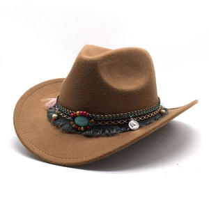 Detail of wool western cowboy hat with ethnic beaded band, tassels and silver coin
