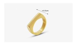 Macro shot of gold flat-top geometric ring showing 0.5cm width measurement detail