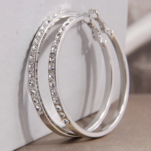 Elegant silver hoop earrings with sparkling crystal accents and a minimalist polished finish