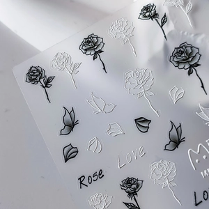 3D embossed nail stickers featuring elegant black and white roses and butterfly motifs