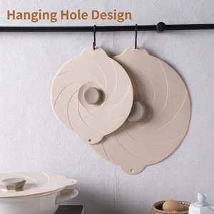 Stackable silicone suction lids in beige with spiral texture and hanging hole design