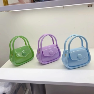 Three mini macaron jelly bags in green, purple, and blue with glossy finish shown in detail