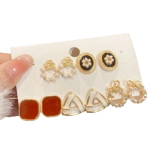 Five-pair vintage earrings set with pearls, bowknots and geometric triangles on card