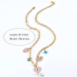 Detail of gold chain necklace with pink heart and blue eye pendants showing measurements