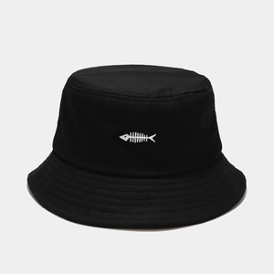 Close-up of the white fishbone embroidery and fine stitching on the black bucket hat