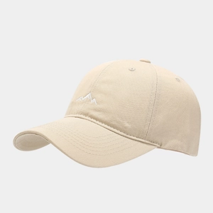 Detail of mountain embroidery on beige cotton twill baseball cap with curved brim