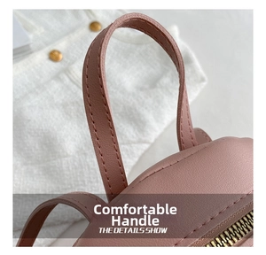 Detail of pink PU leather backpack with sturdy handle and gold metal zipper
