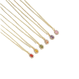 Elegant gold necklaces with colorful oval gemstone pendants and sparkling crystal accents