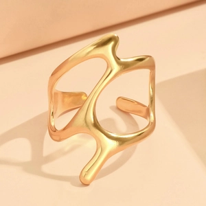 Minimalist irregular wavy golden stainless steel open ring on a geometric stand