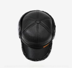 Top view of black leather winter hat with warm grey plush lining and ear flaps