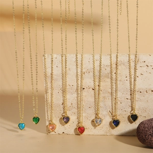 Elegant gold-plated heart-shaped crystal pendant necklace set in multiple vibrant colors
