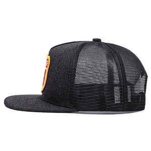 Side view detail of gray trucker hat with vintage patch and breathable black mesh