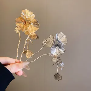 Elegant gold and silver flower hair pins with crystals and tassels in a set