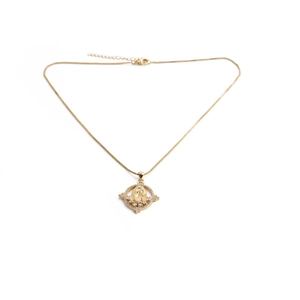 Detail of 18K gold plated necklace featuring a Virgin Mary pendant with cubic zirconia