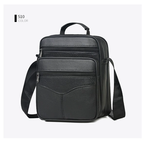 Detail view of black pebble leather texture and multi-layer zippers on men's messenger bag