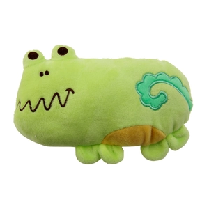 Detail of green plush dinosaur dog toy with turquoise cloud embroidery on soft fabric